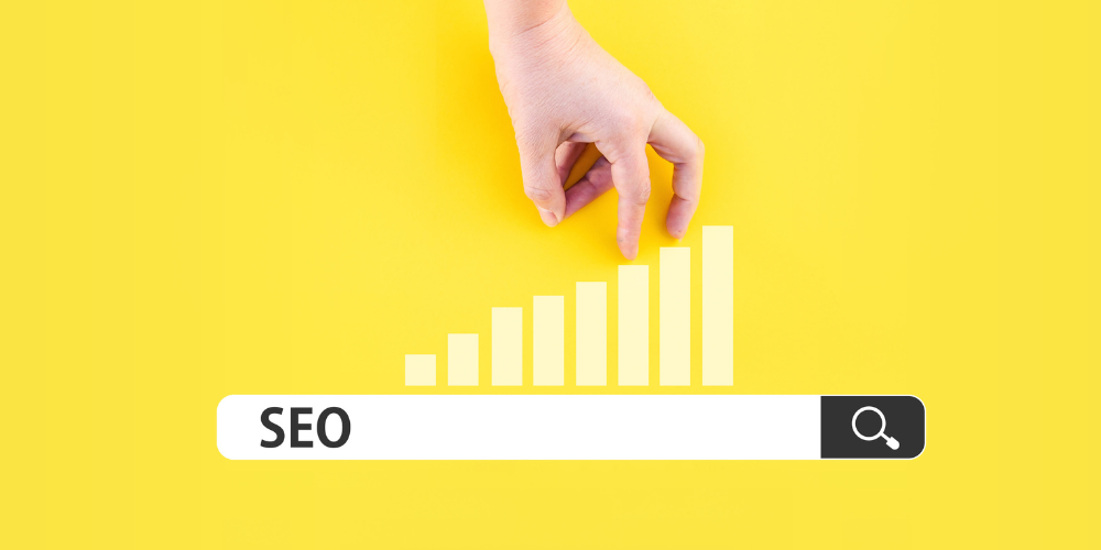 A hand walking up a bar graph labeled SEO on a yellow background, representing search engine optimization strategy.