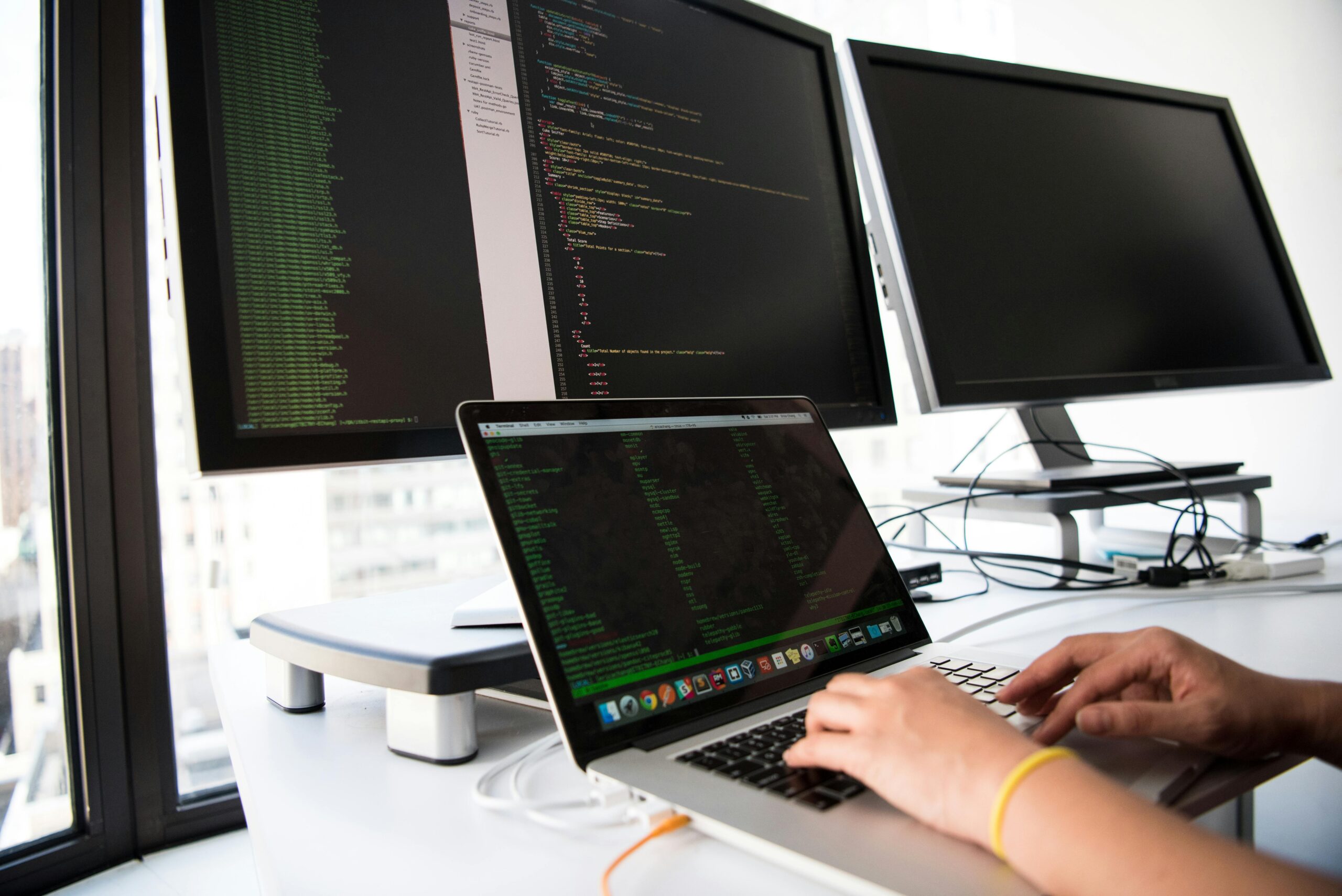 Focused coder writes scripts for a nearshore software development project.