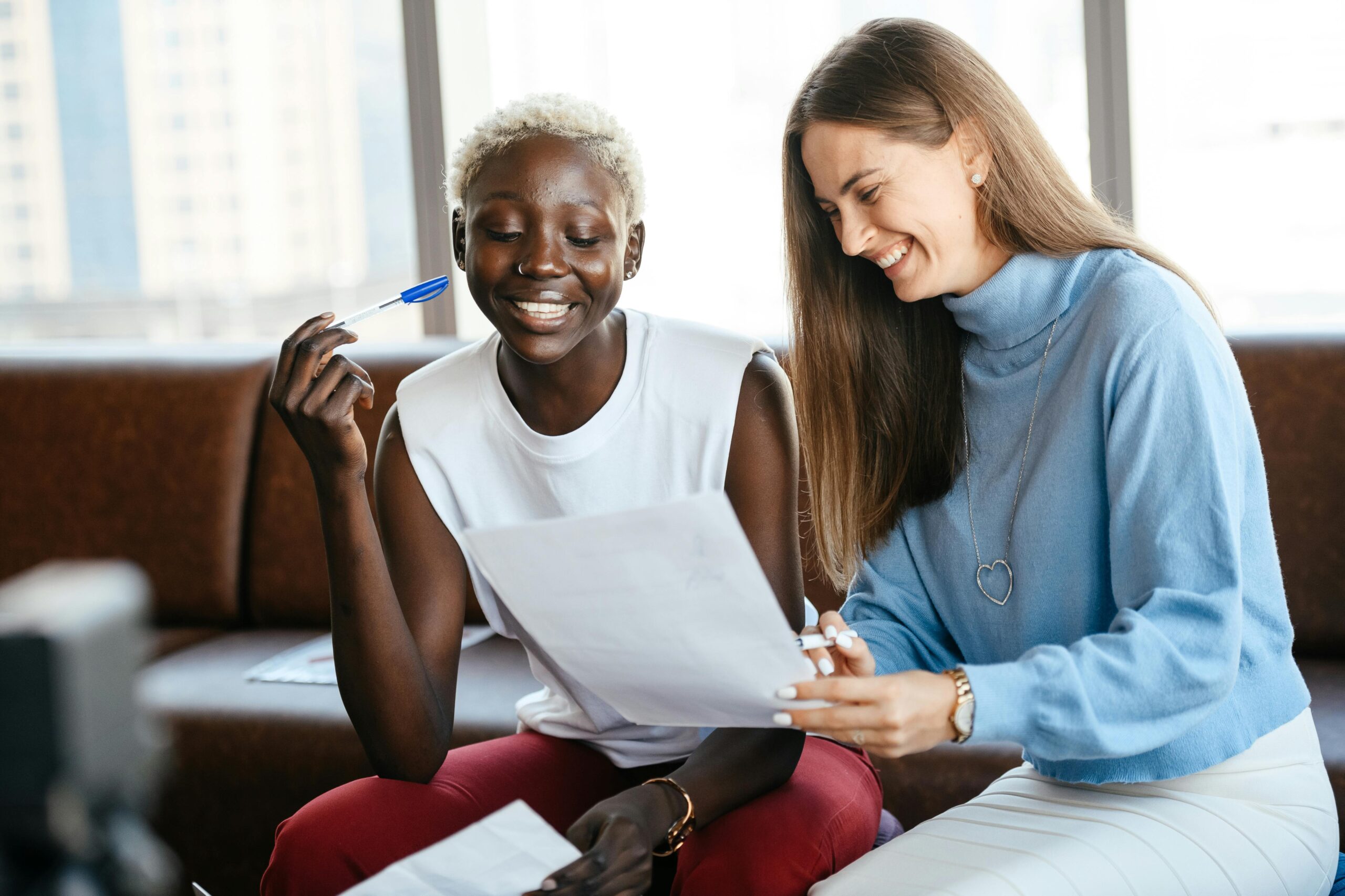 Two individuals in a collaborative setting, with the hiring manager displaying interpersonal skills during a candidate review.