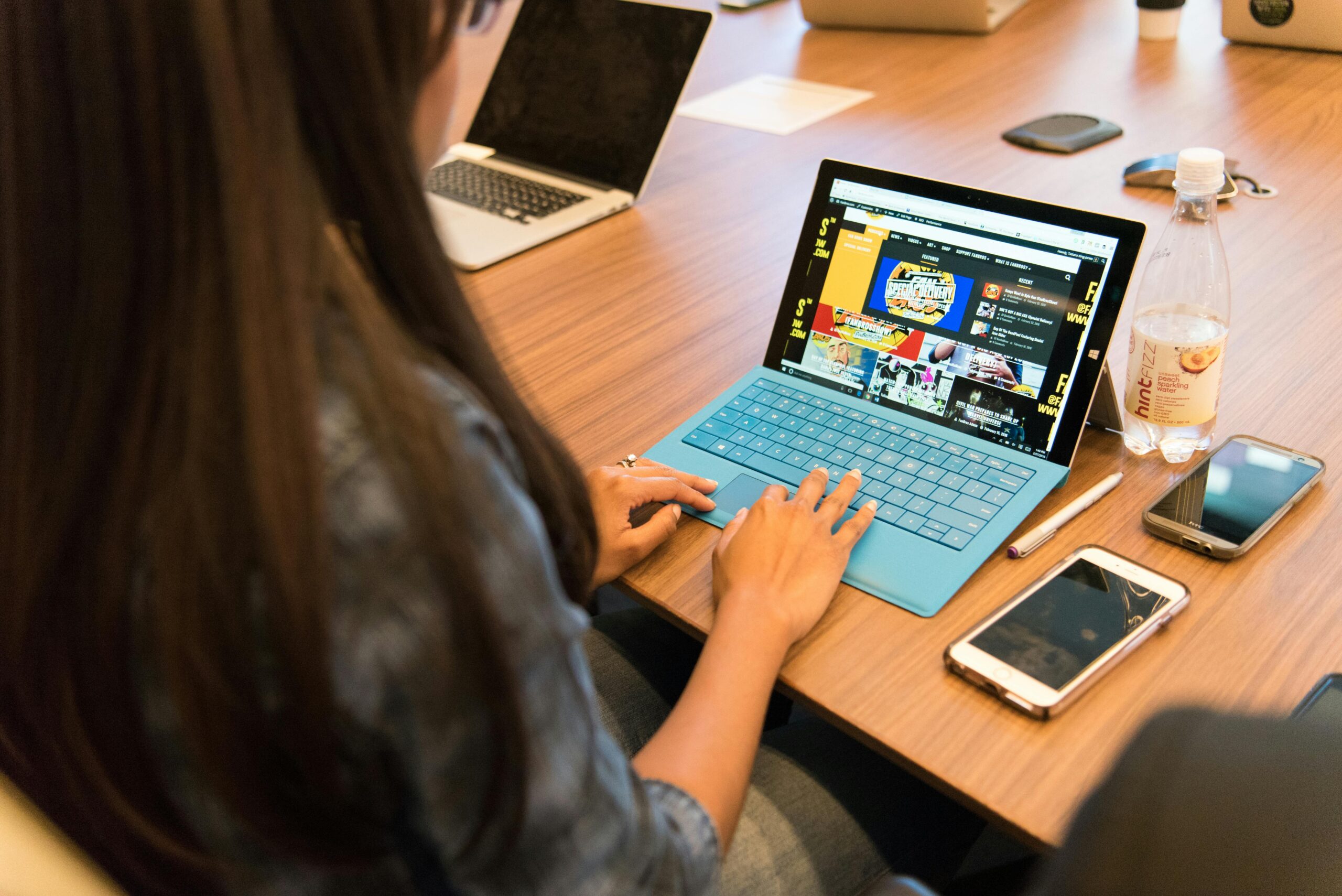 A team member working on a laptop.