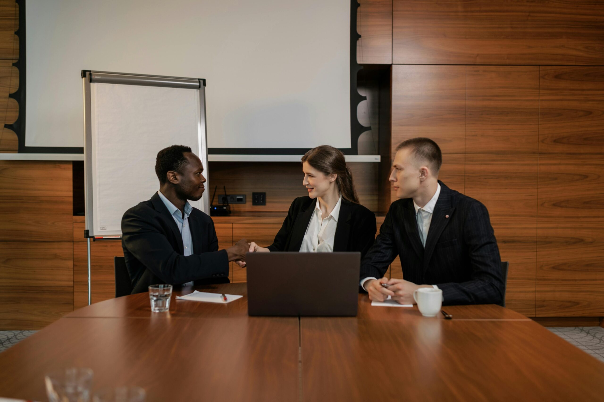 Business professionals discuss potential quick to hire job placements.
