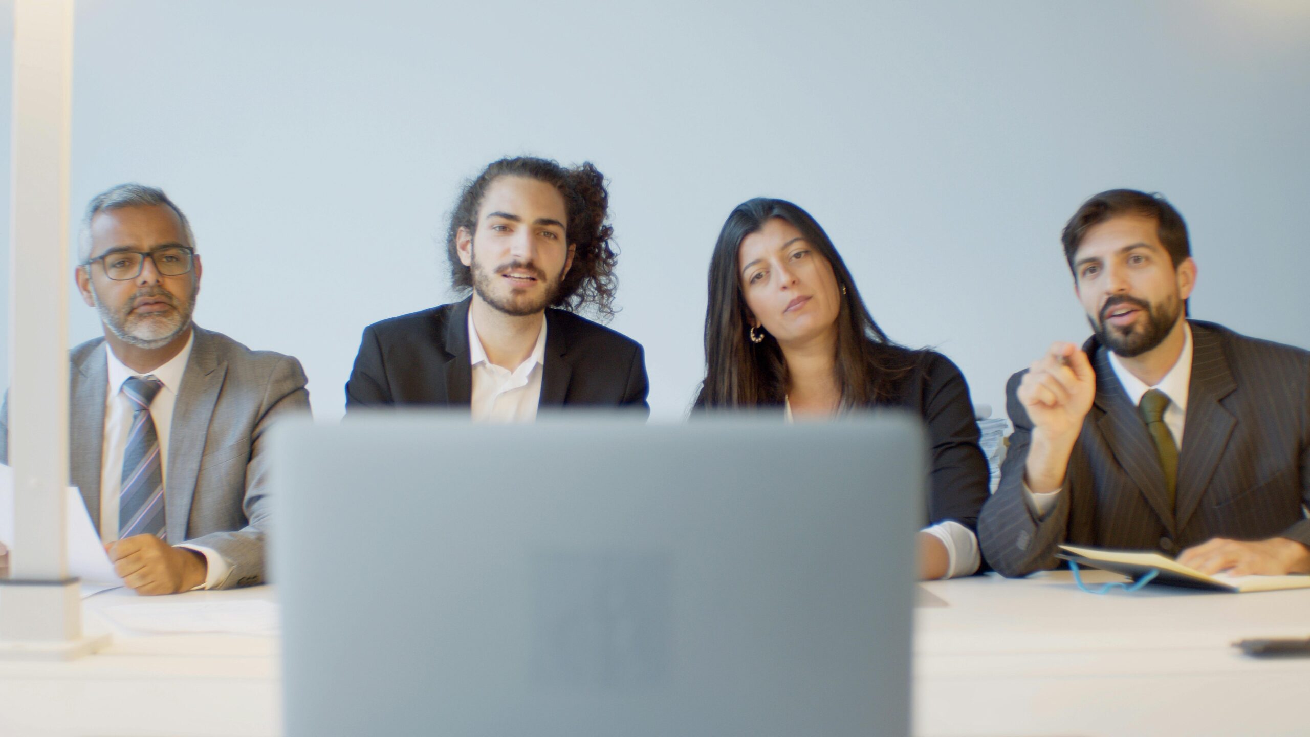 Business team during a conference, an integral service of outsource employment agencies.