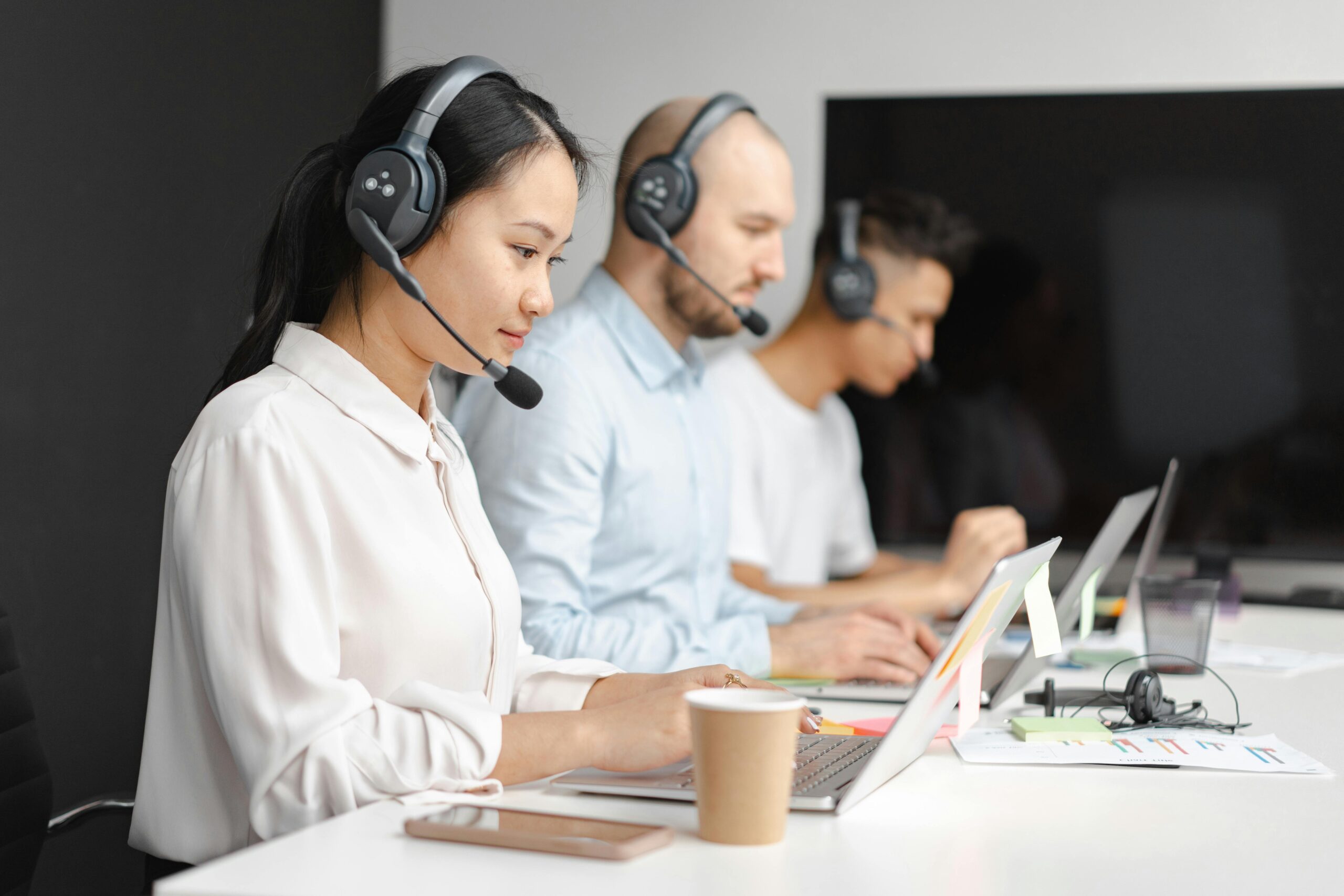 A team actively managing calls and providing support in a modern office.