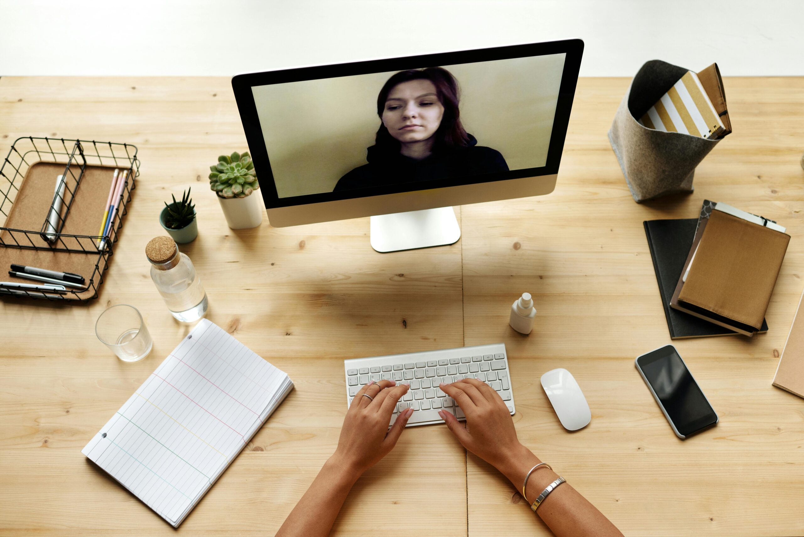 Remote HR manager in a virtual meeting, communicating with team members.