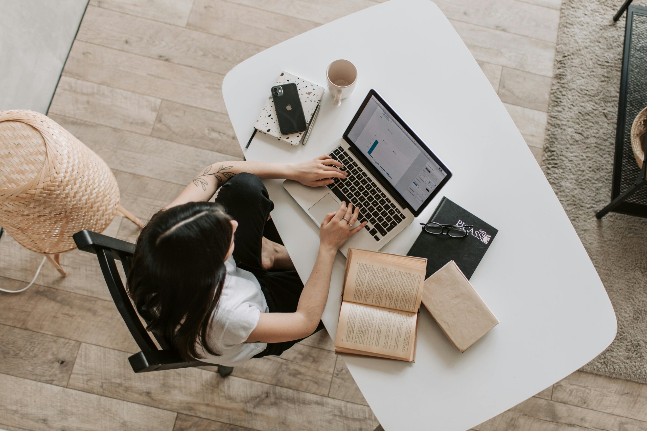 A woman working remotely on a laptop.