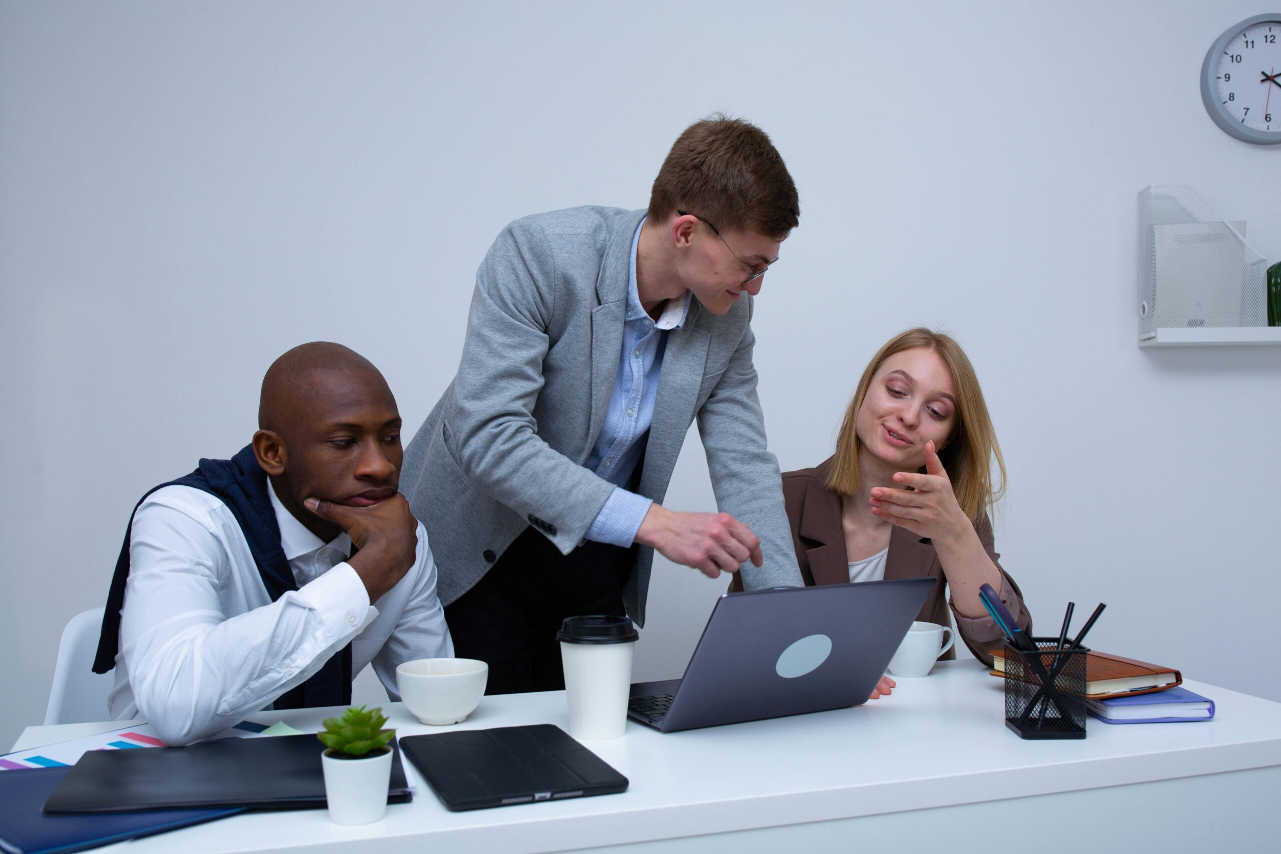 Team working together guided by marketing outsourcing companies.