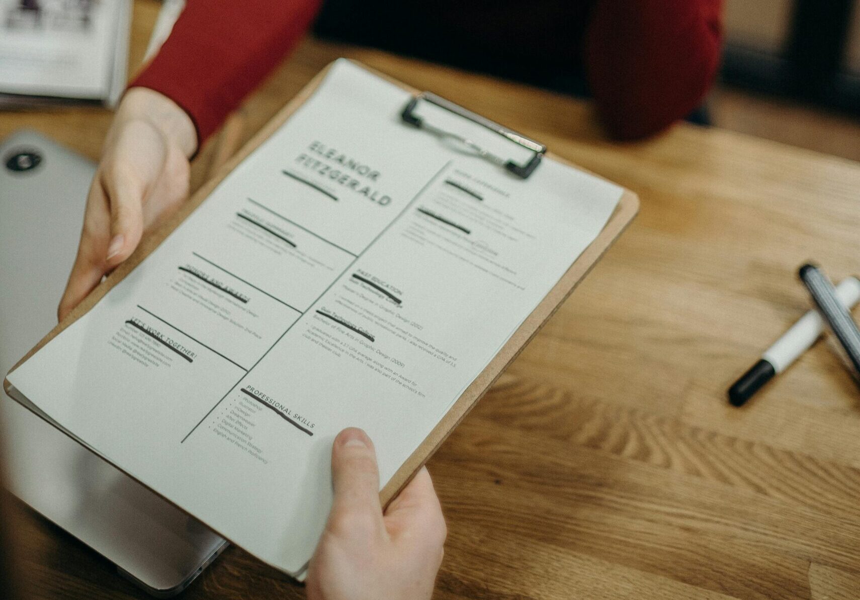 Professional reviewing a resume through international job search agencies.