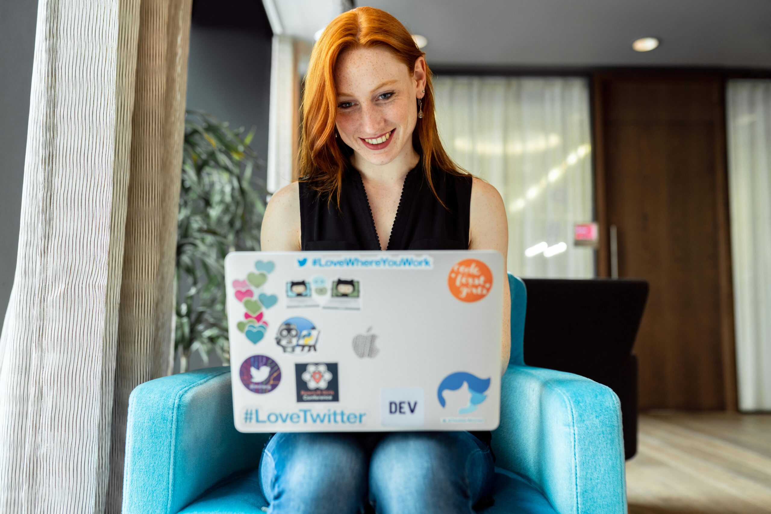 Smiling woman working remotely.