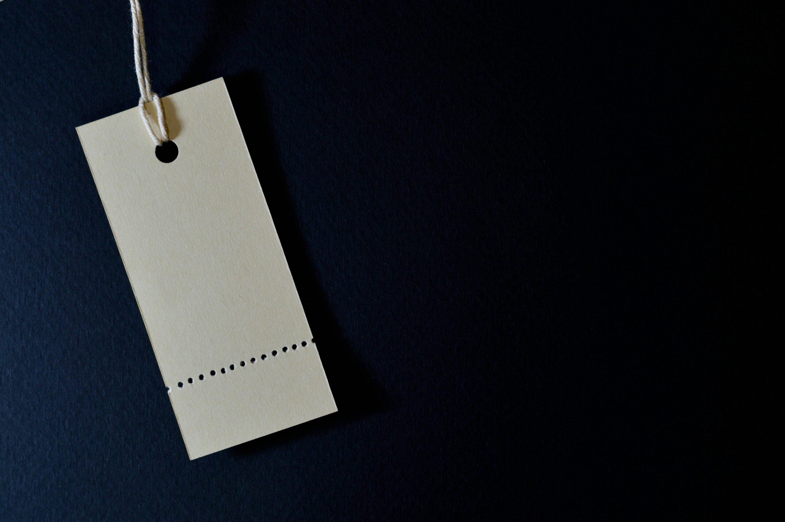 Price tag on a dark background, illustrating the price element of the marketing 4Ps.
