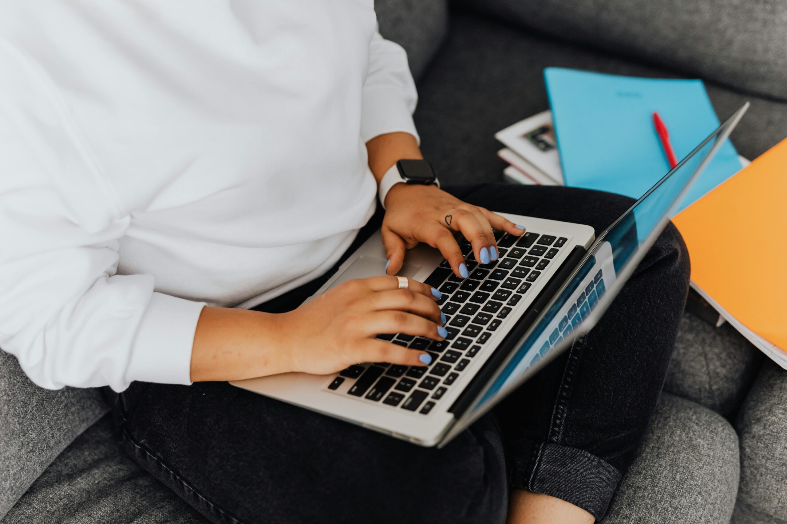 Person typing on a laptop.