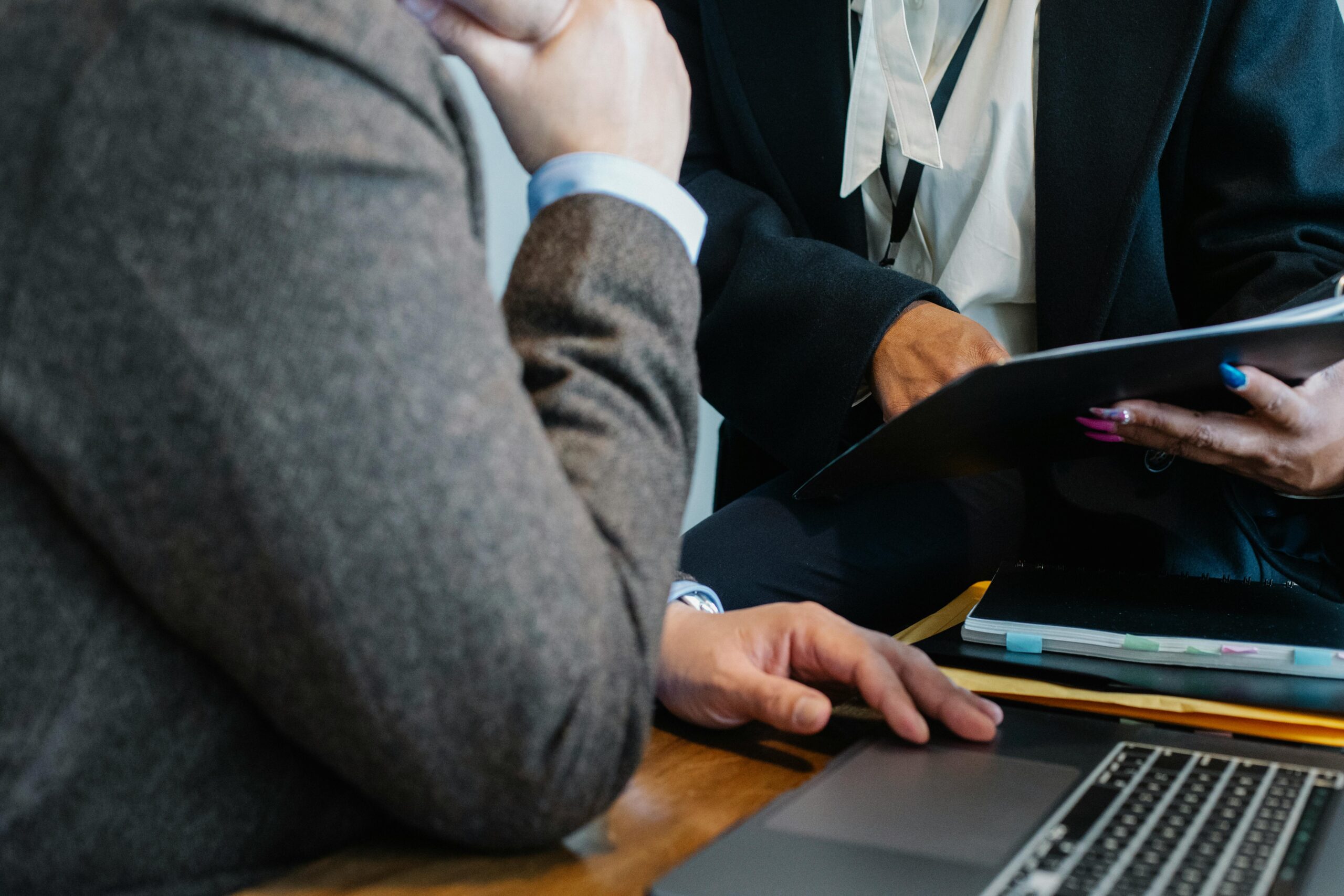 Close-up of a virtual executive assistant discussing documents with a client.