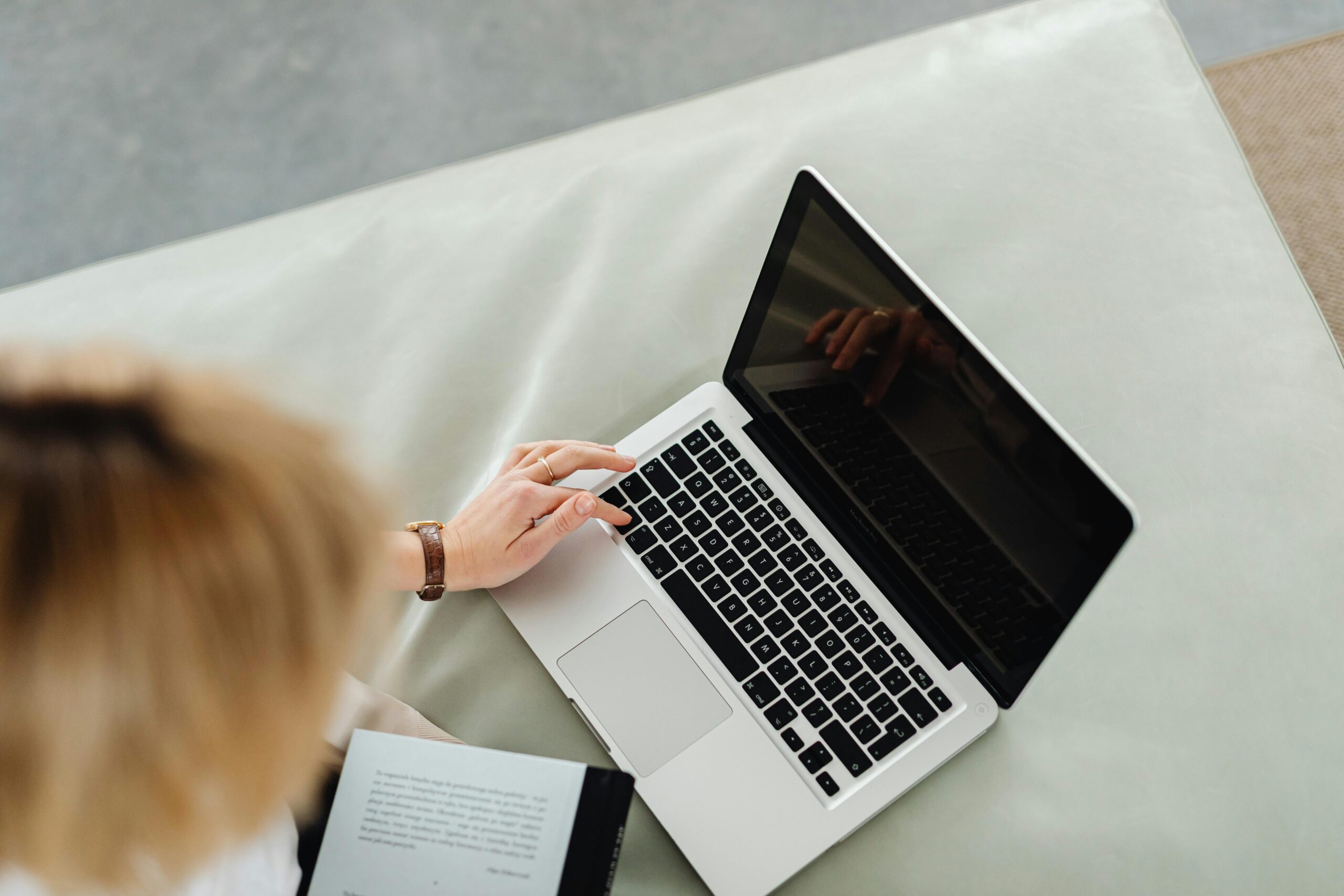 Overhead view of a person working on a laptop.