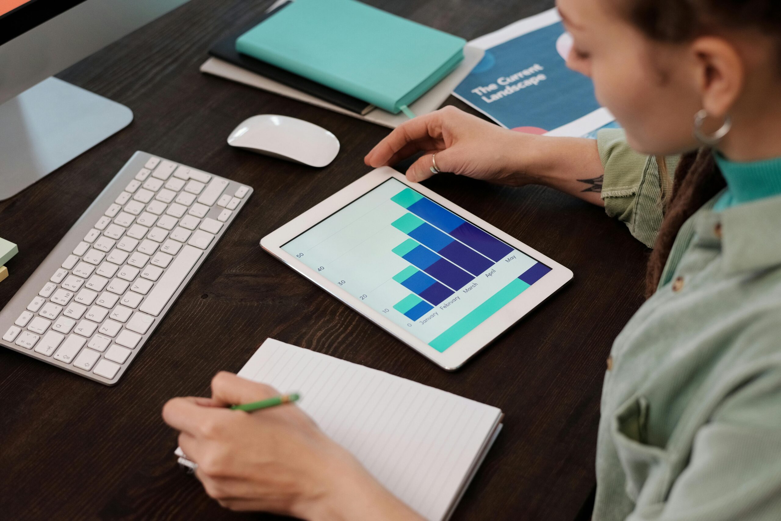 A remote marketing director analyzing data on a tablet.