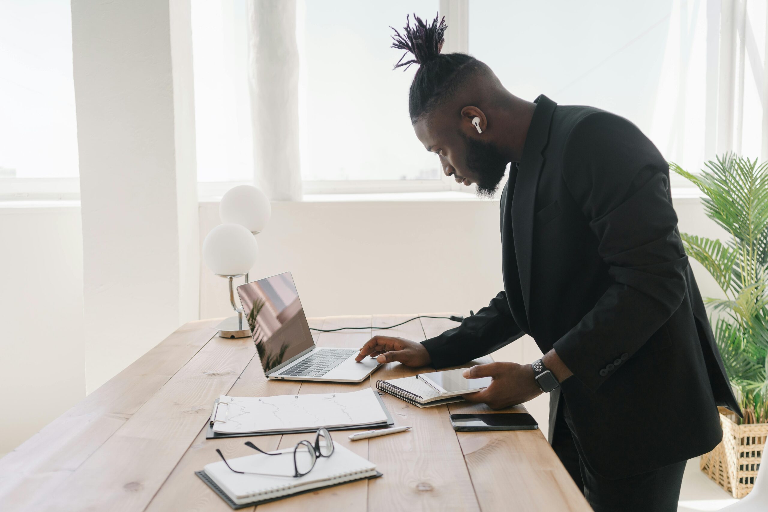 A remote marketing manager working at a standing desk.