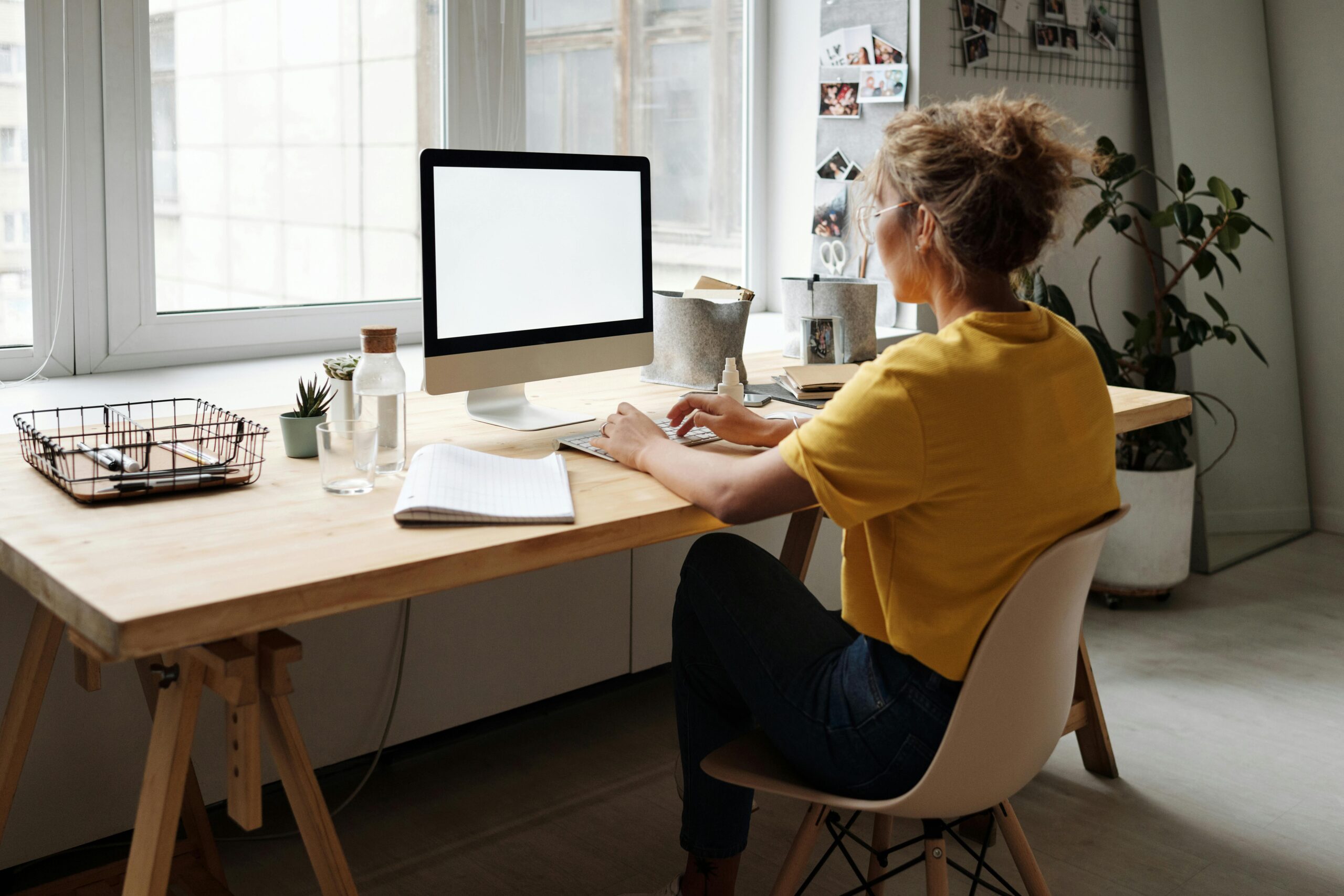 Remote human resources manager working from a home office setup.