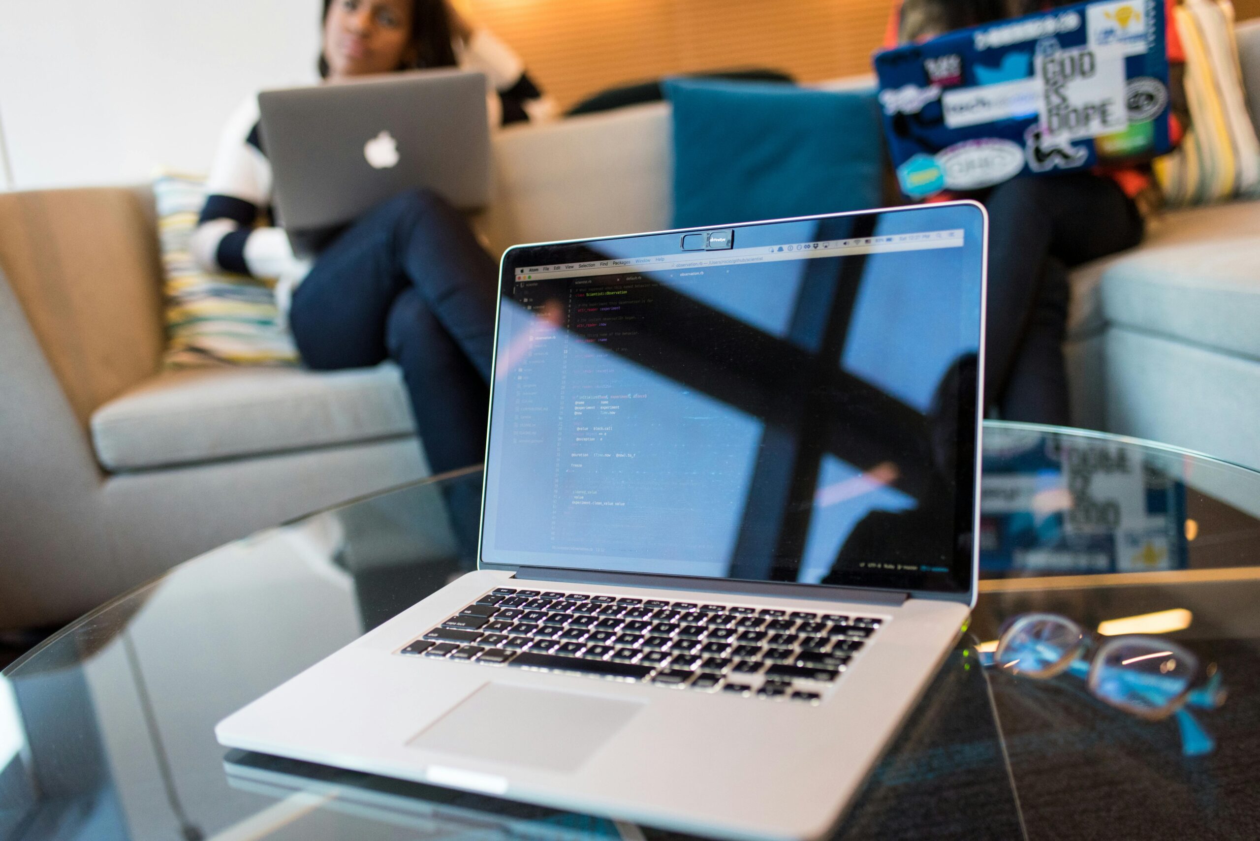Laptop displaying code, representing the work of an offshore development team.