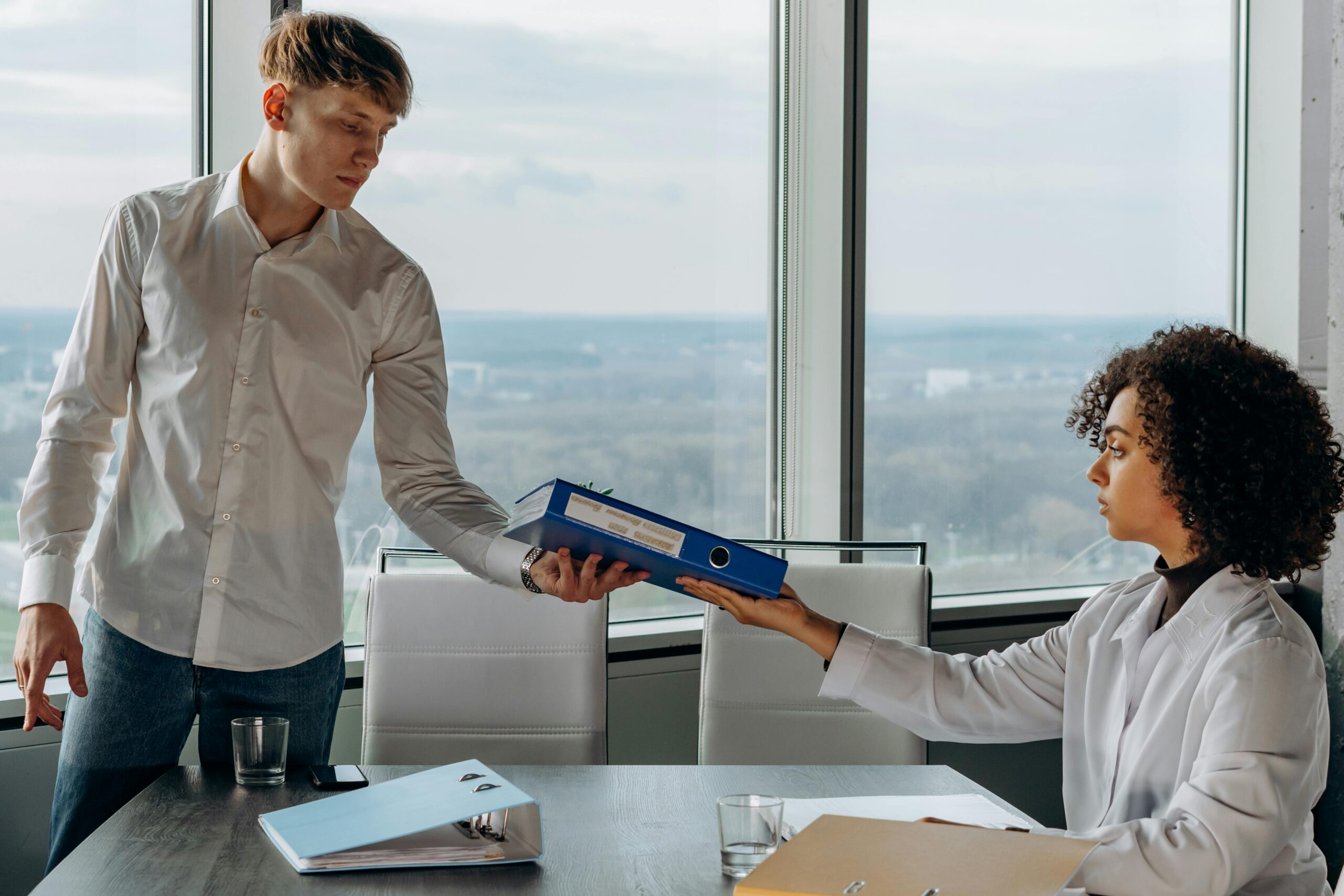 A remote account manager discussing documents in office.