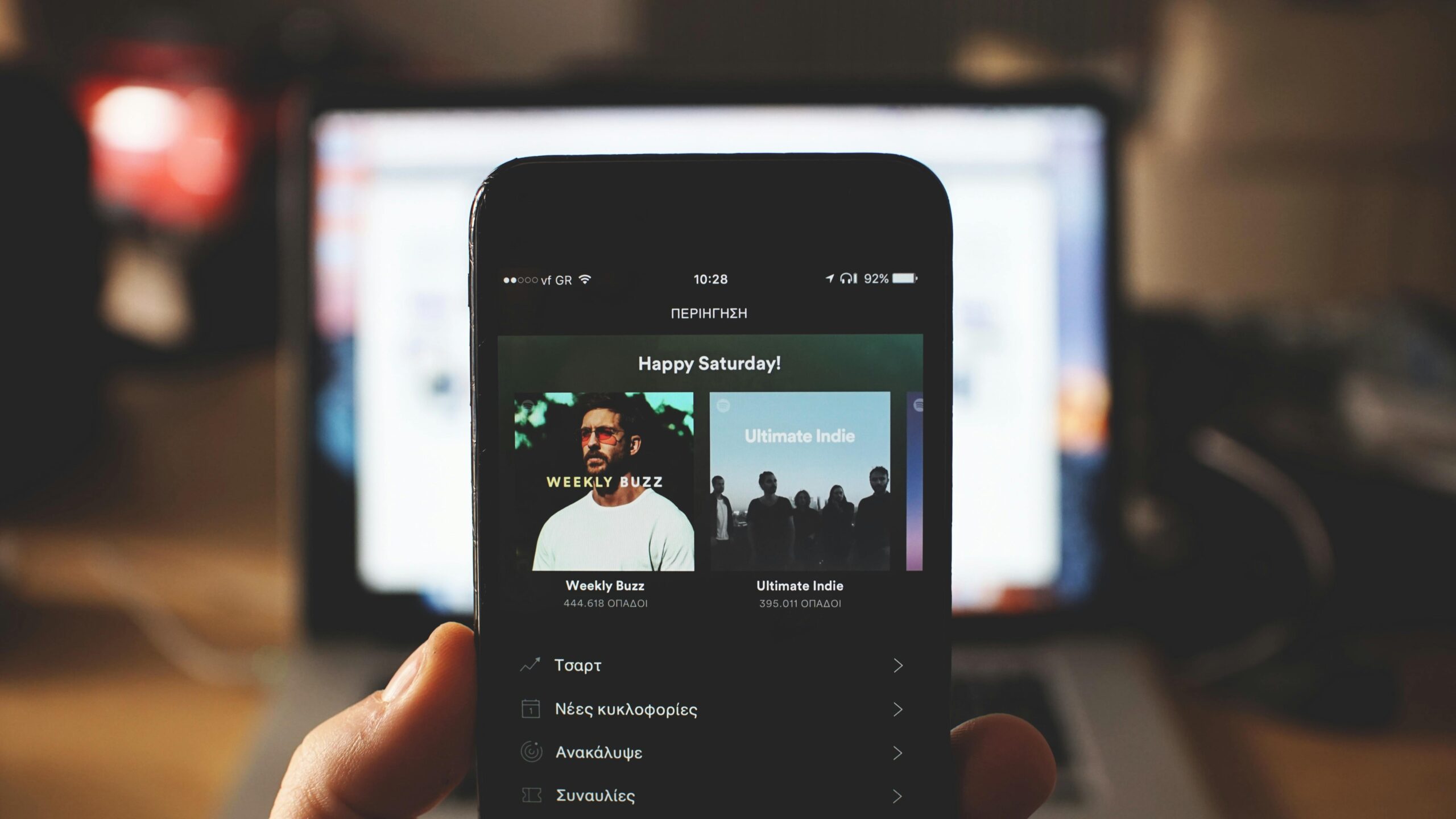 A person viewing music streaming app content, selected by a digital media buyer.