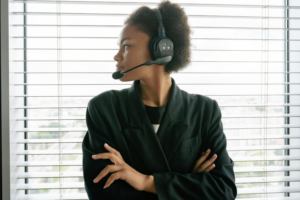 Professional working for B2B sales outsourcing companies in the USA with a headset, ready to assist clients.