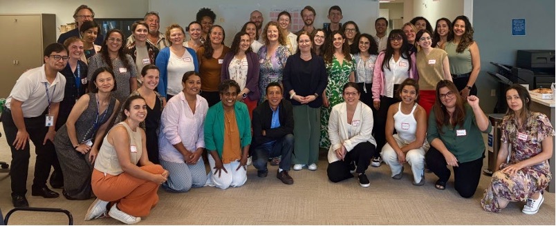 A group of about 40 people posing for a photo