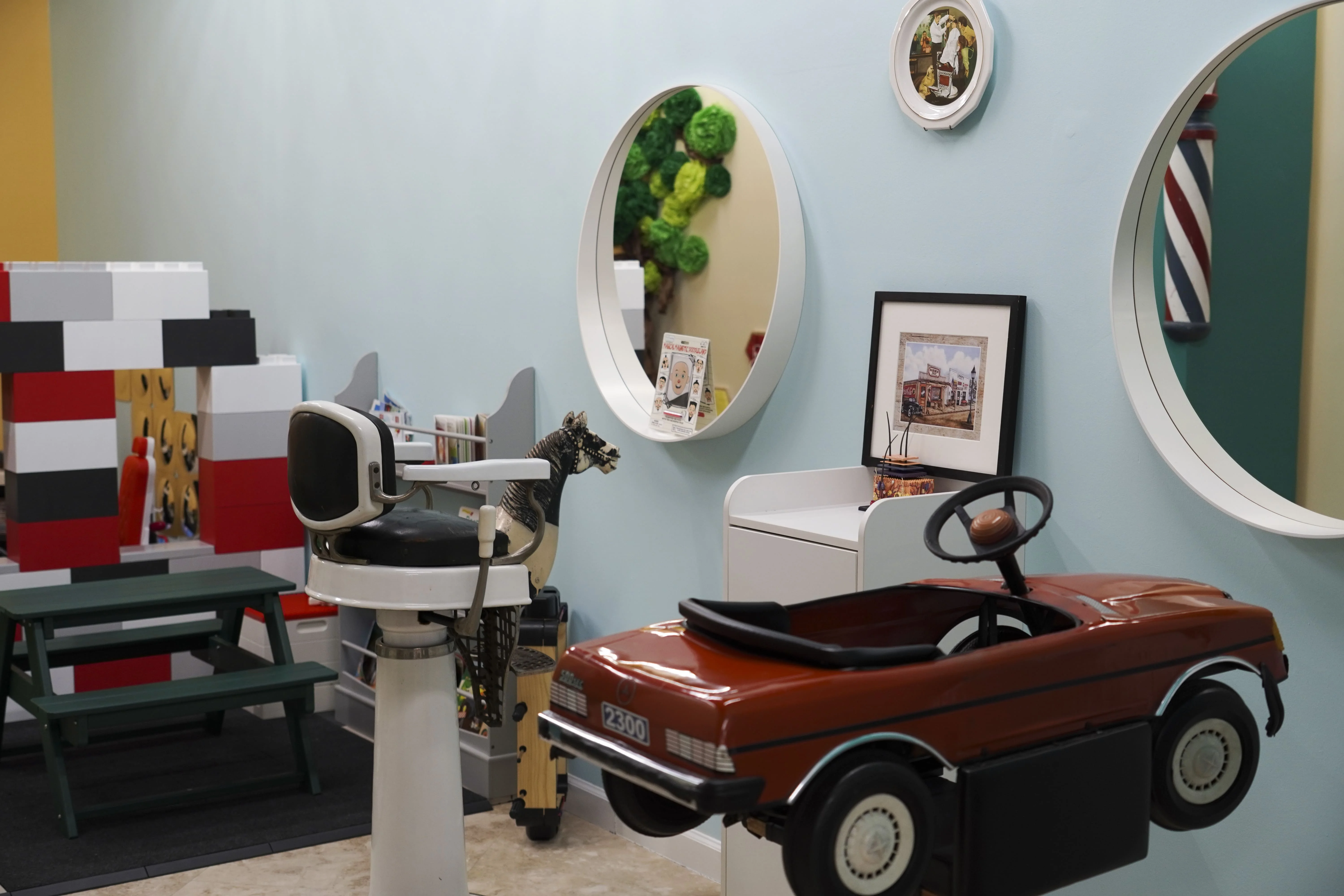 The two children haircut chairs at our barber shop in Sunny Isles Beach