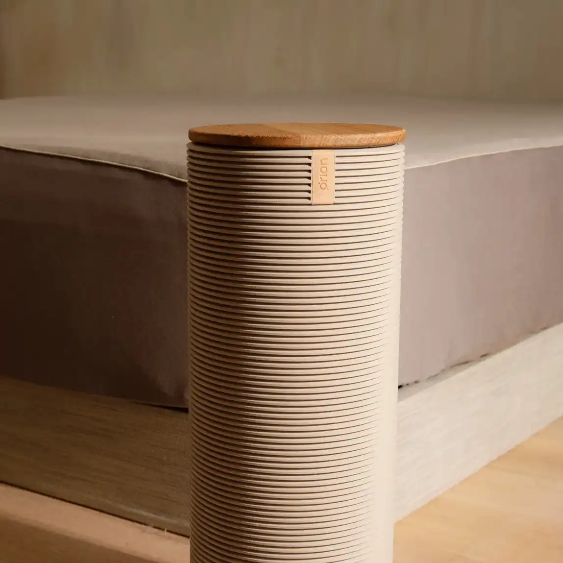 An Orion Control Tower in front of a bed. The mattress is covered by the Smart Cover. 