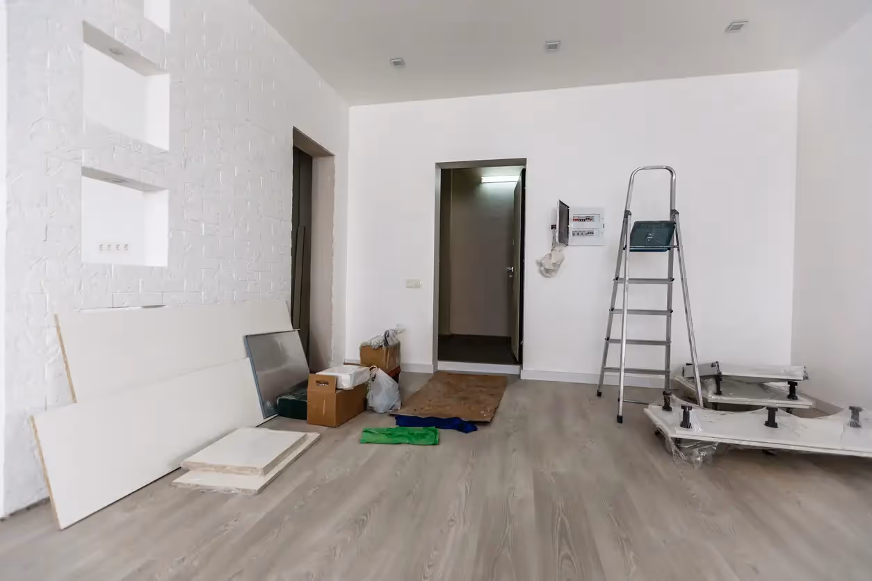 Empty room with materials and ladder for tenant improvements