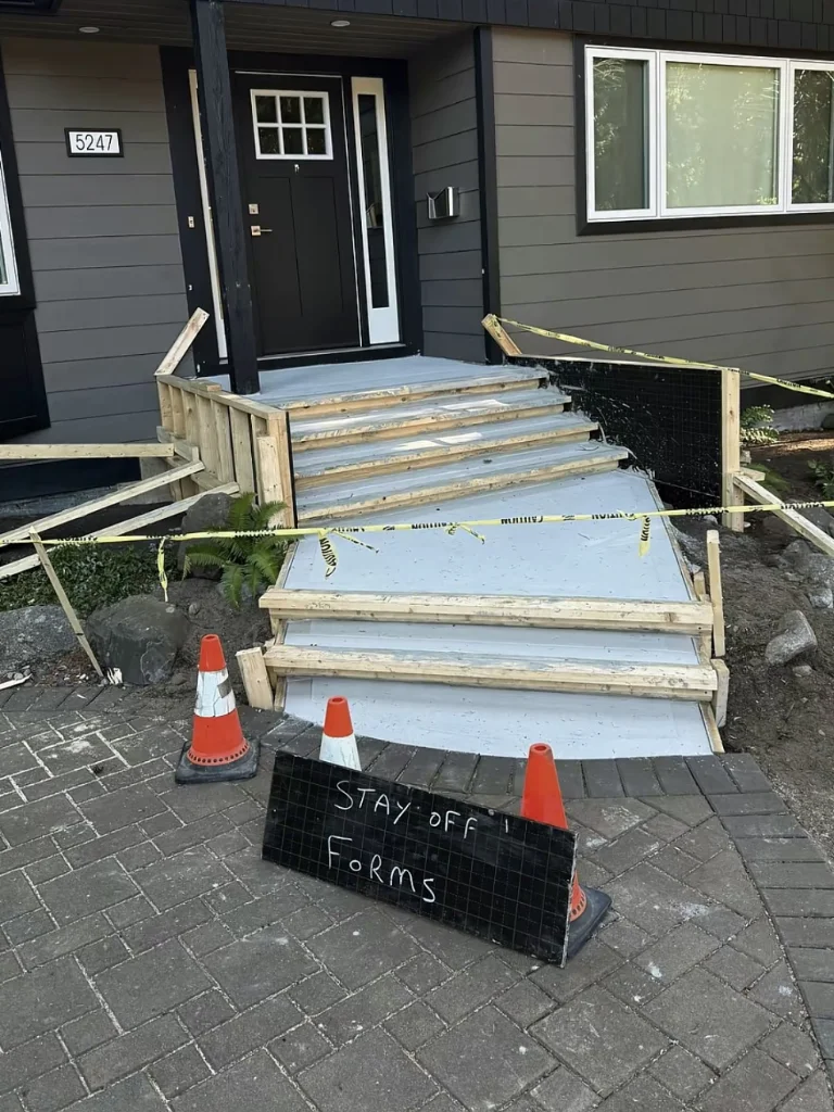 Concrete step pouring process near a house
