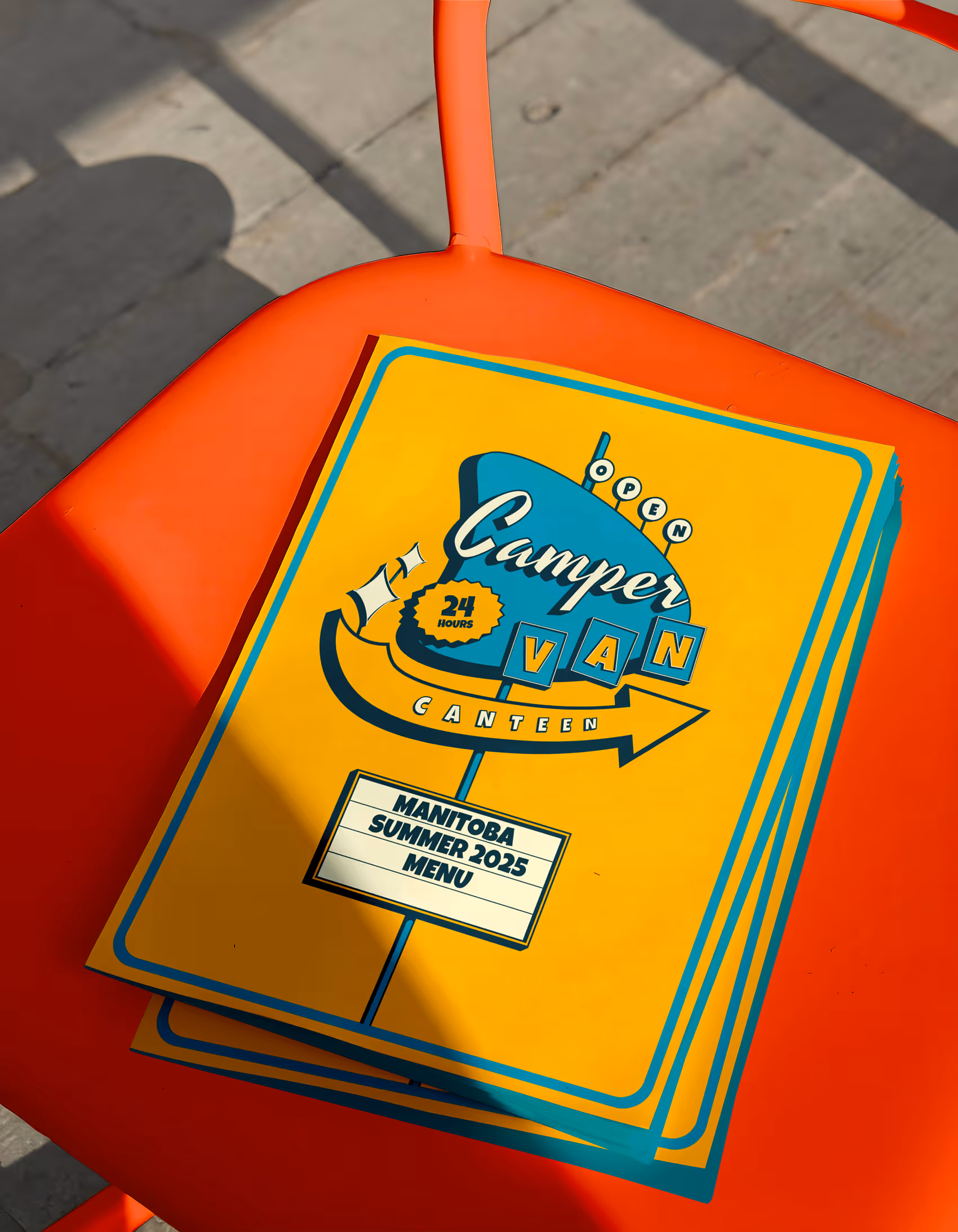 A retro diner style menu on a brightly coloured diner chair