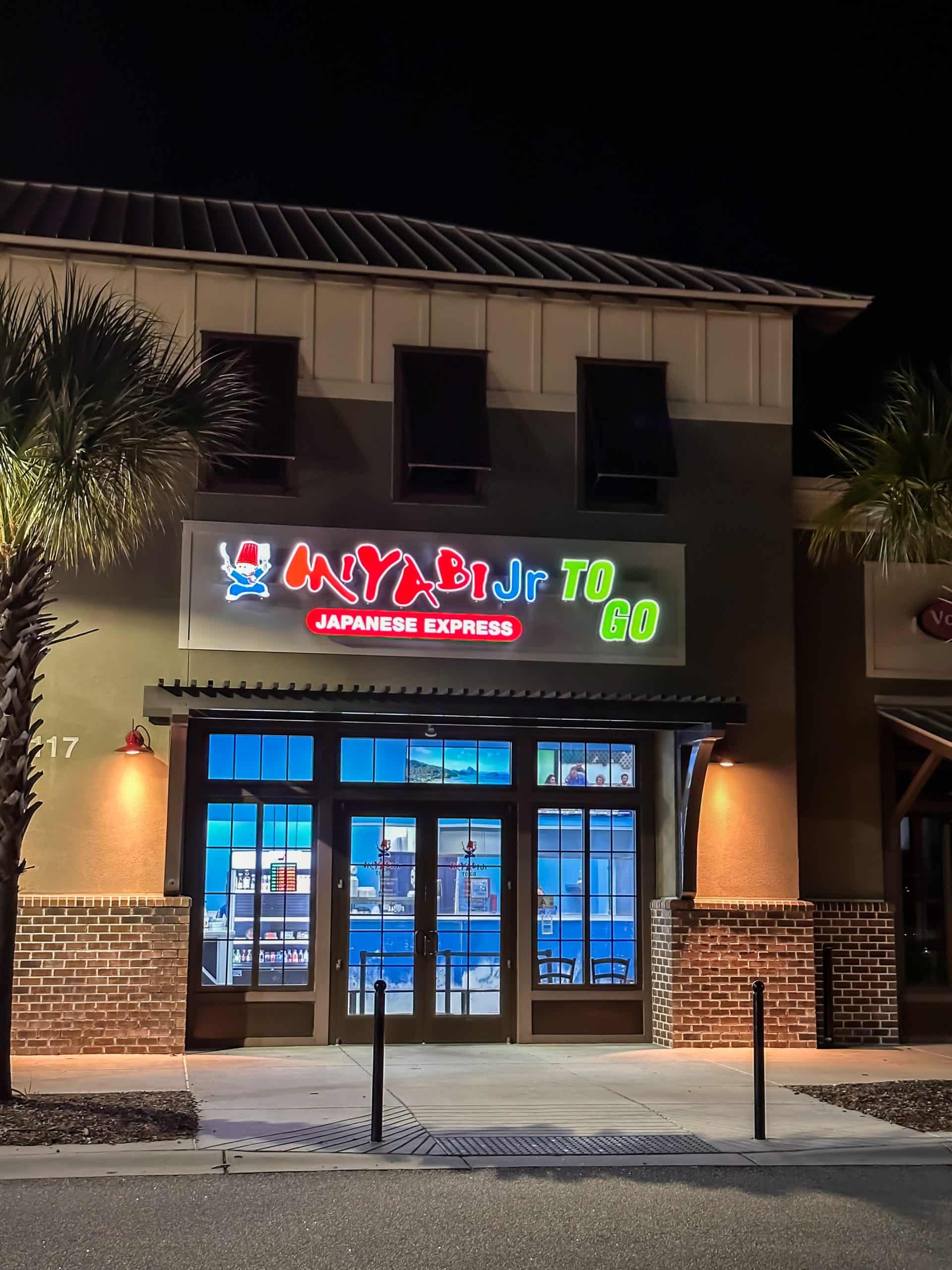 Illuminated Miyabi Jr. Express storefront at night in Surfside Beach, SC.