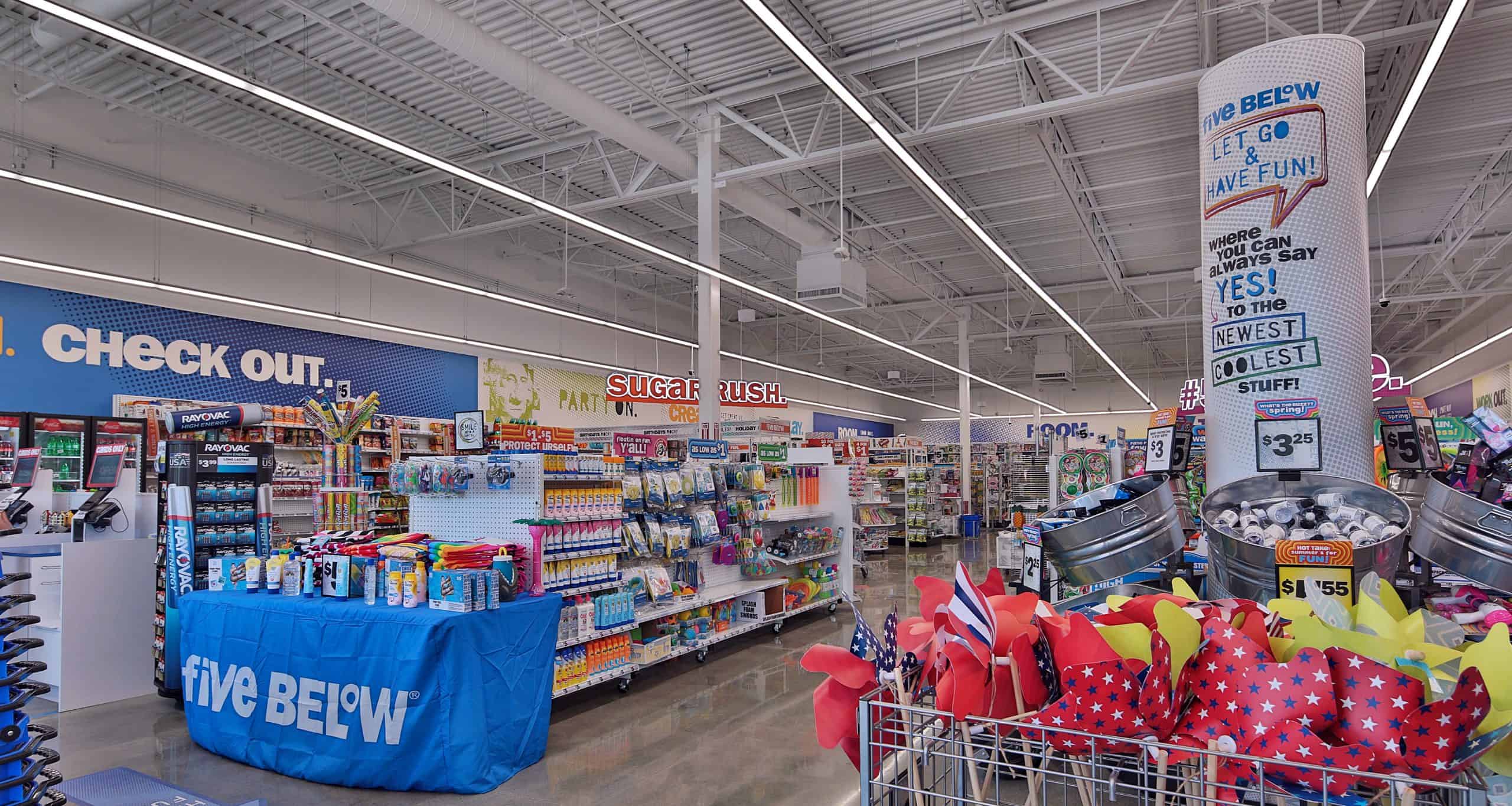 Checkout area and front merchandise displays at Five Below in Holly Springs, NC.