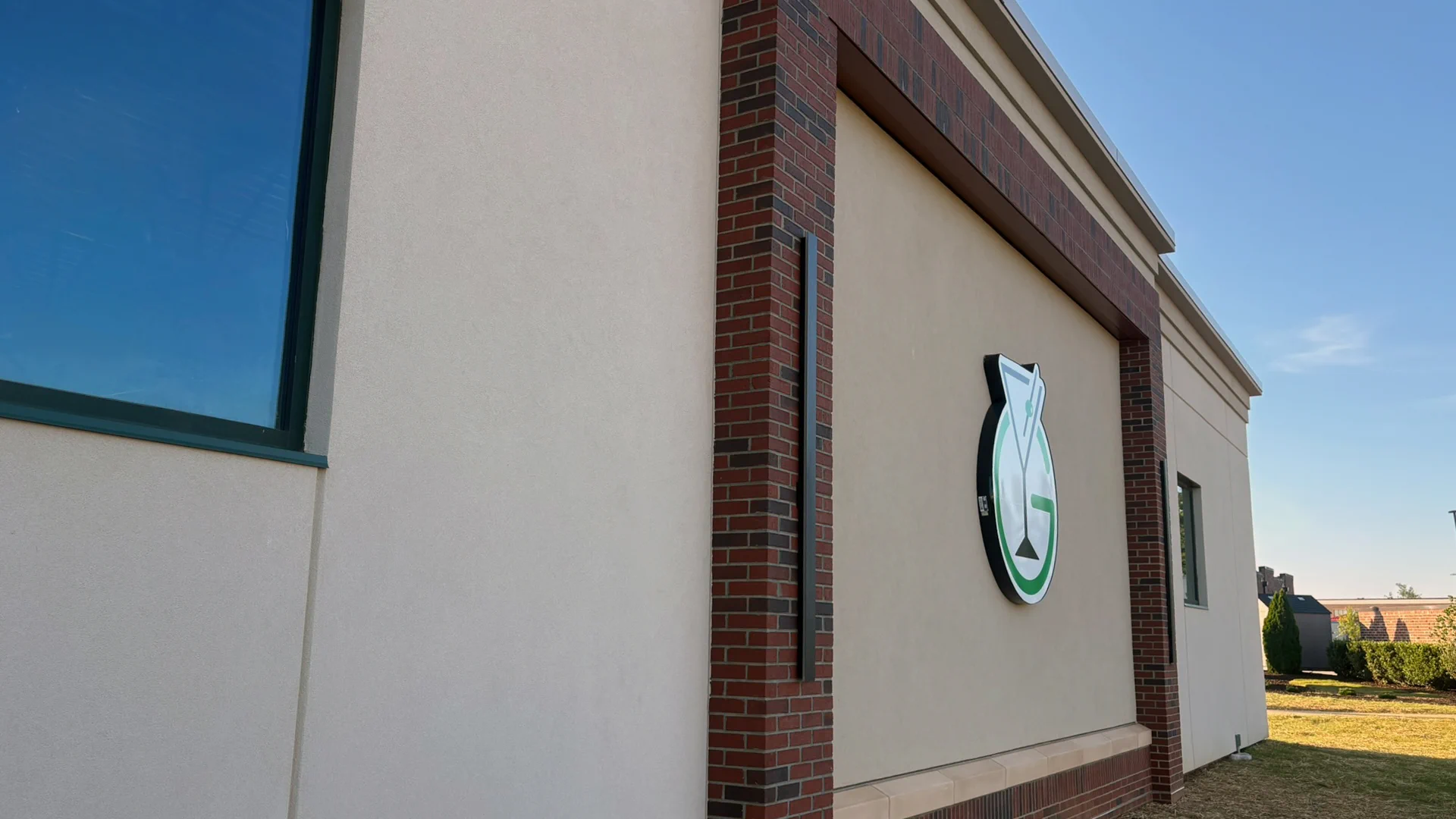 Brick and stucco exterior with Greensboro ABC signage at the store on Redbourne Drive.