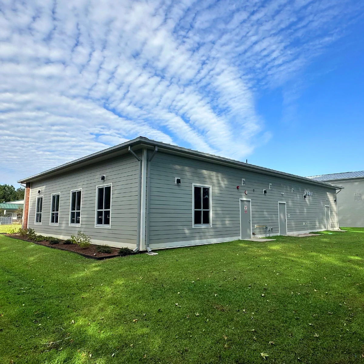 Gray-sided addition and lawn at Socastee Fire Station 1 in South Carolina.
