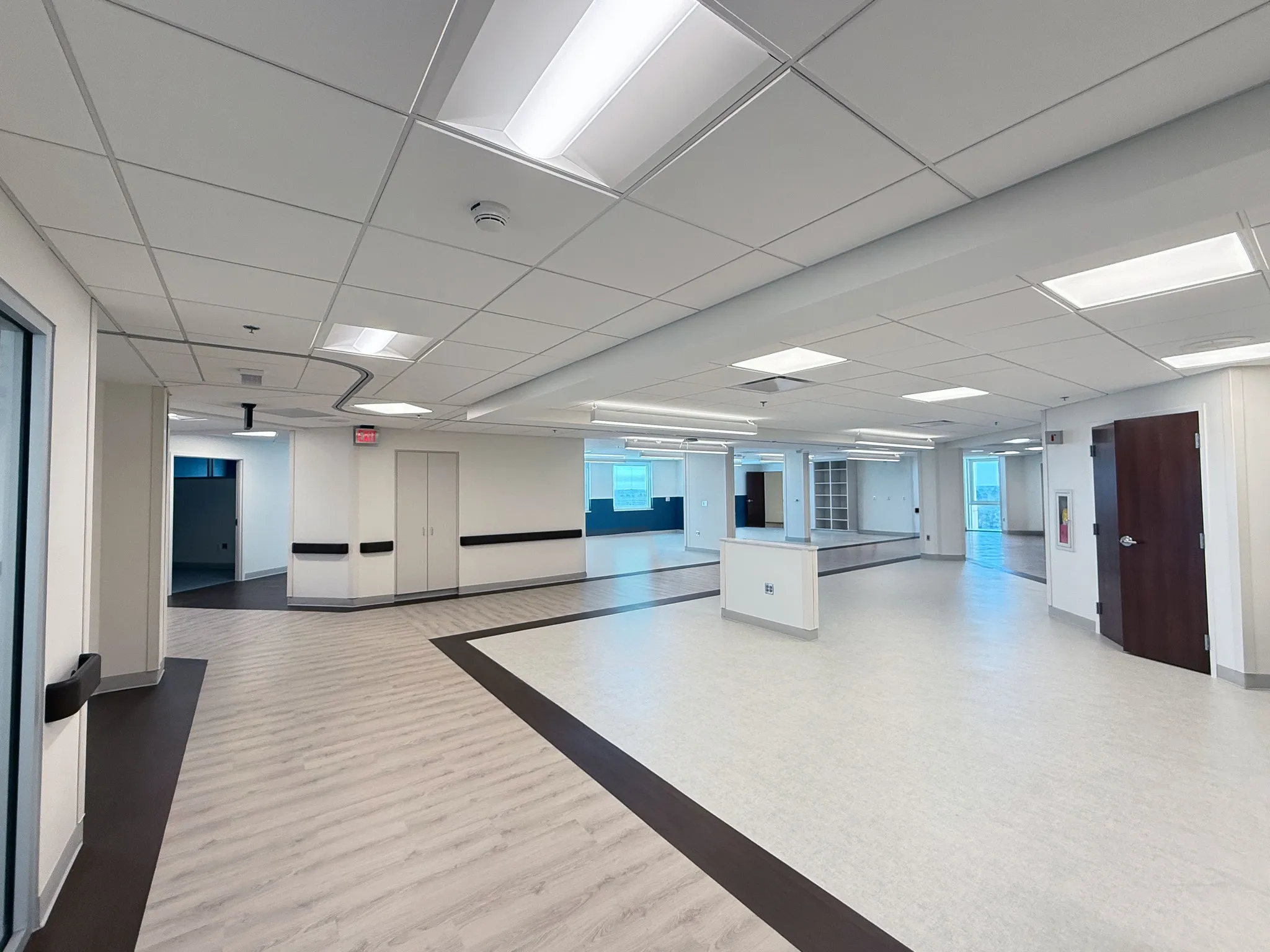 MUSC Florence interior facing a central divider and adjoining windowed rooms.