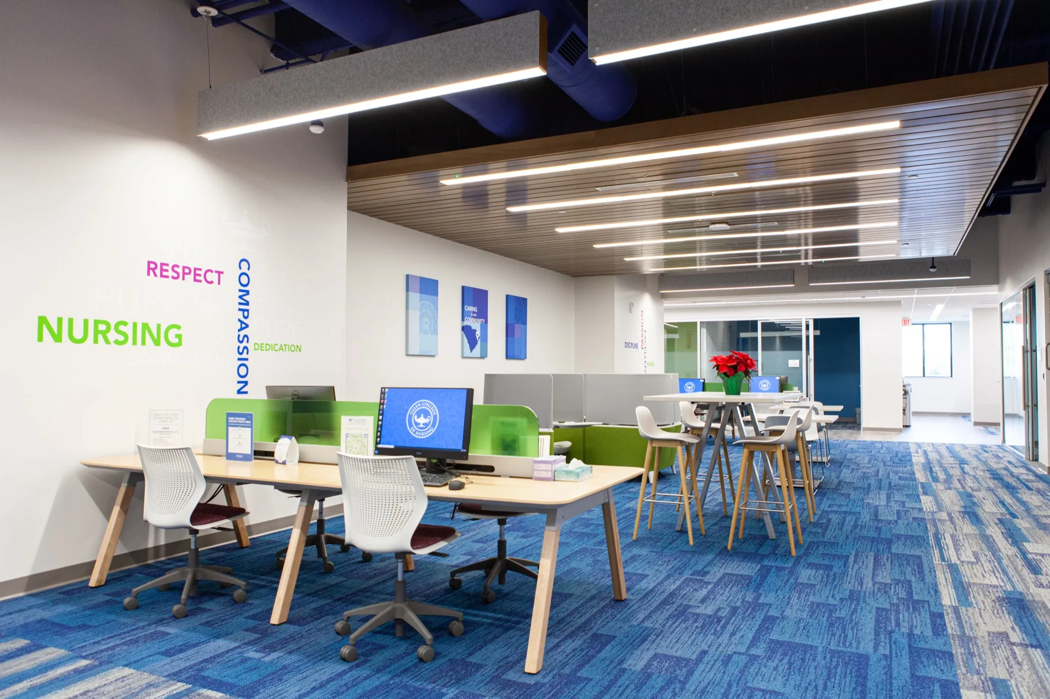 Shared computer workspace beneath a slatted ceiling at Galen College of Nursing in Myrtle Beach.