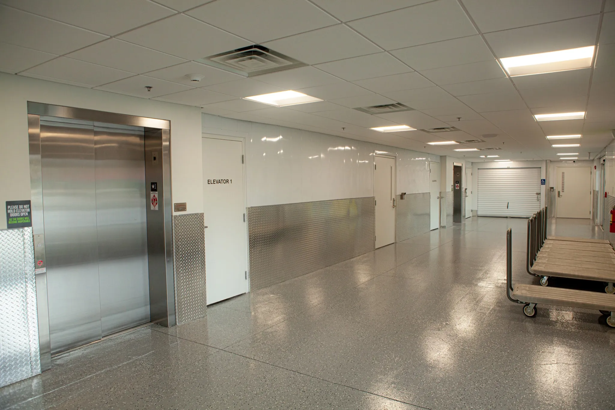 Elevator and flatbed carts in the Extra Space Storage corridor in North Myrtle Beach.