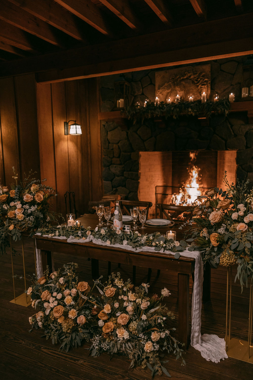 Goodstock Productions with Jessica Miriam at indoor wedding with lots of greenery.