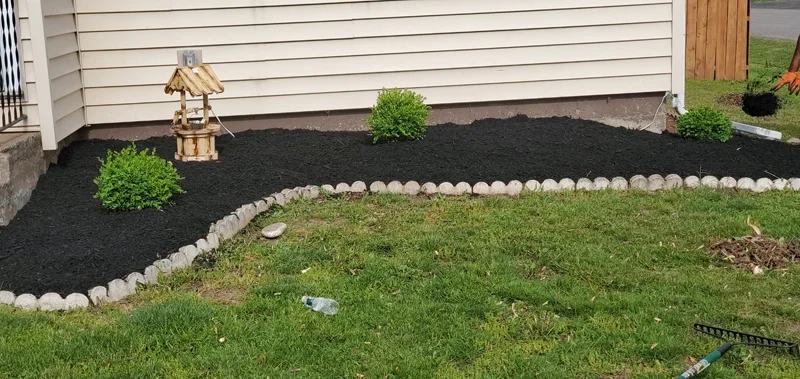 Mulch application and garden clean-up project completed by Diamond Landscape & Design.