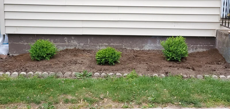 Mulch application and garden clean-up project completed by Diamond Landscape & Design.