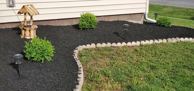 Mulch application and garden clean-up project completed by Diamond Landscape & Design.