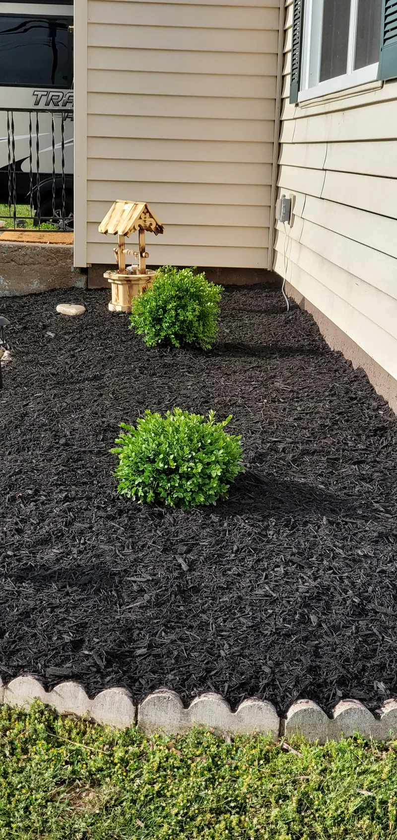Mulch application and garden clean-up project completed by Diamond Landscape & Design.