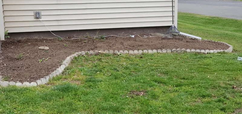 Mulch application and garden clean-up project completed by Diamond Landscape & Design.