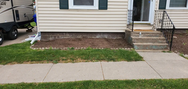 Mulch application and garden clean-up project completed by Diamond Landscape & Design.