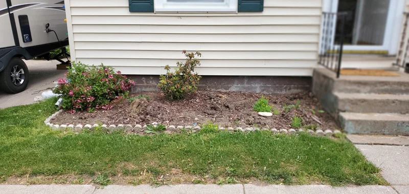 Mulch application and garden clean-up project completed by Diamond Landscape & Design.