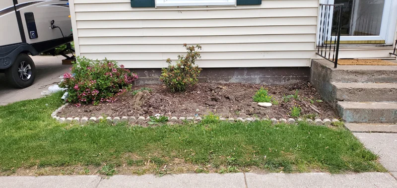 Mulch application and garden clean-up project completed by Diamond Landscape & Design.