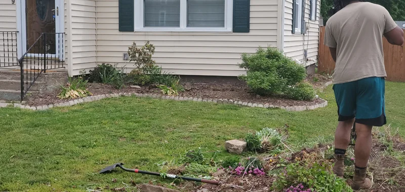 Mulch application and garden clean-up project completed by Diamond Landscape & Design.