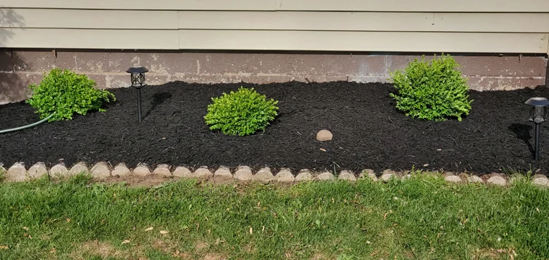 Mulch application and garden clean-up project completed by Diamond Landscape & Design.