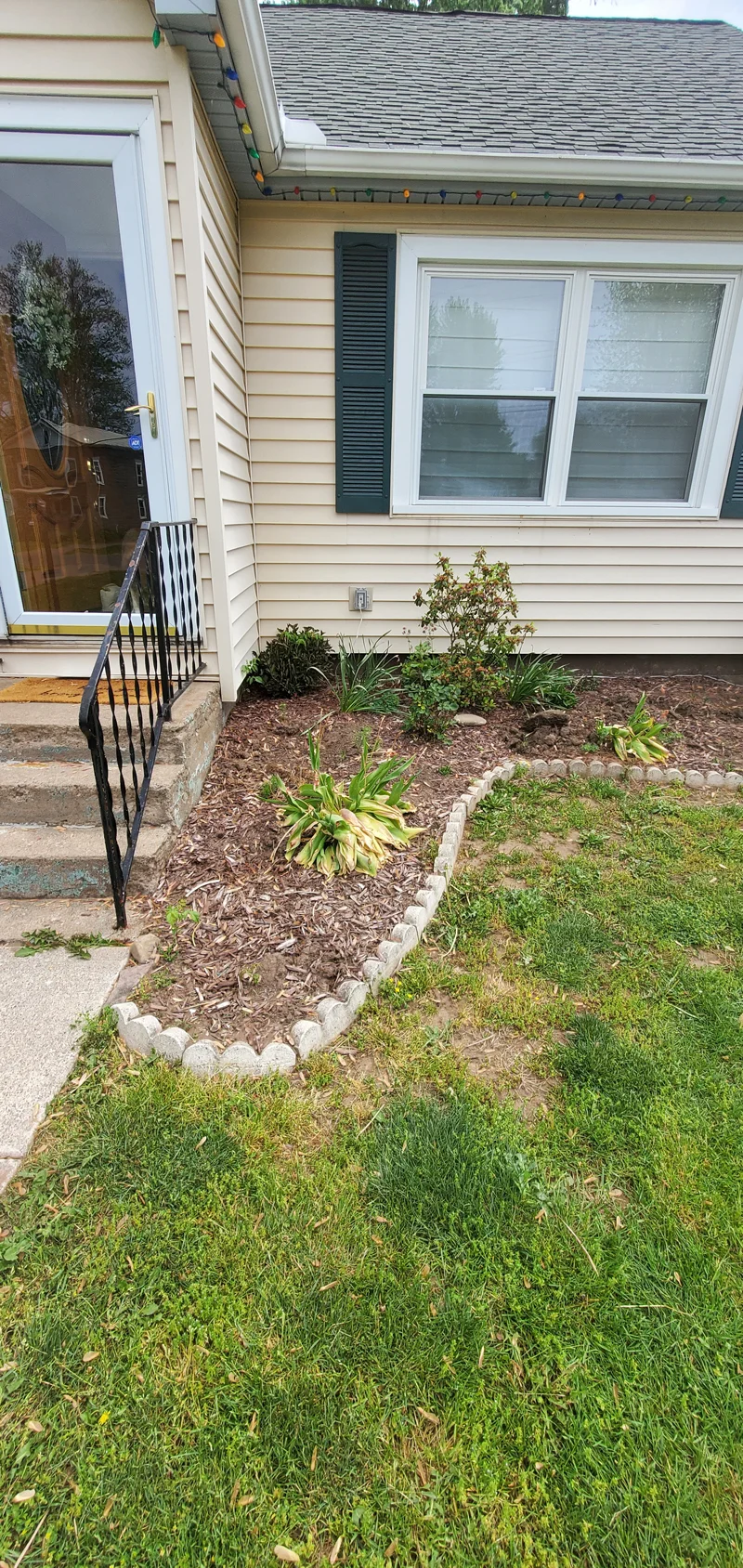 Mulch application and garden clean-up project completed by Diamond Landscape & Design.