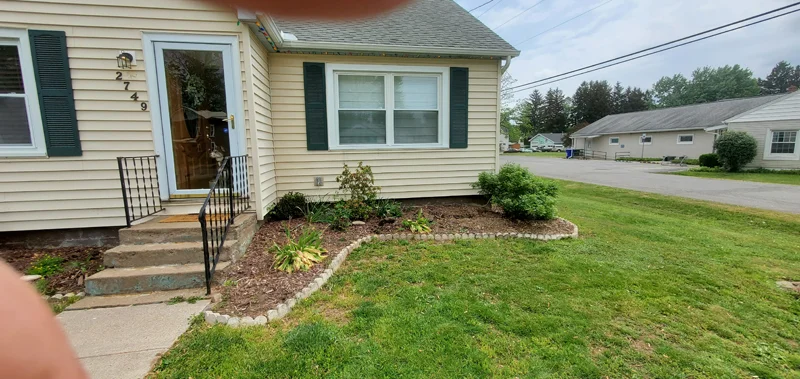 Mulch application and garden clean-up project completed by Diamond Landscape & Design.