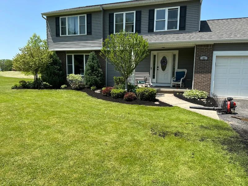 Garden bed cleanup, edging and mulch application project completed by Diamond Landscape & Design.